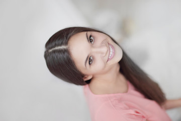 Fototapeta premium close up.portrait of beautiful young woman on light blurred background