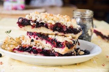 Bluberry and currant cake, glass with berries.