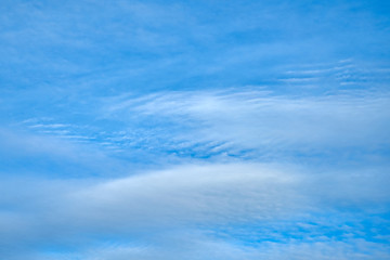 Blue sky with clouds background.