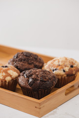 Dellicious homemade muffins on table. Sweet pastries