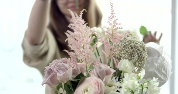 Taking Perfect Flowers for Your Wedding Bouquet. Young florist takes perfect flowers to make a wedding bouquet. Her flowers are wonderful, the colors are so rustic, she has perfect taste