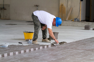 bricklayer at work in building site