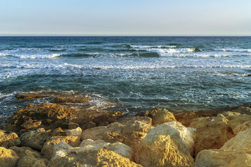 Fototapeta na wymiar Sea, stones, and turquoise water