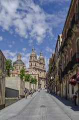 Fototapeta na wymiar Torres de la iglesia de la Clerecia desde la calle San Pablo en Salamanca