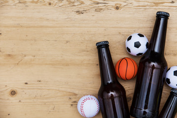 Sports match party. Beer bottle with football, basketball, baseball balls