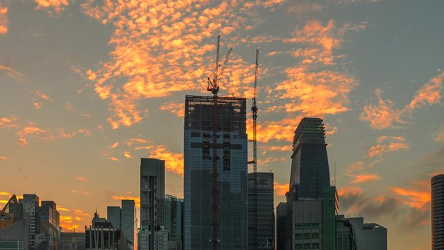 4k Timelapse Movie Sunrise Scene of moving cloud with Constraction Site of Building, Singapore