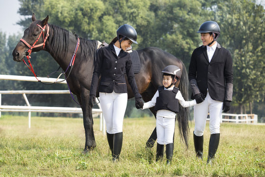 Young Chinese family with horse