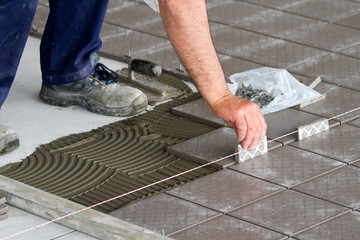 bricklayer at work in building site