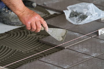 bricklayer at work in building site