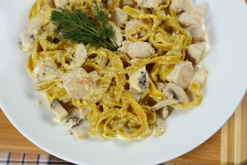 Macaroni of Carbonara with smoked sausage, bacon, sauce. Tasty lunch in the Italian restaurant with herbs, dill