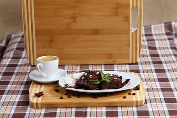 two pieces of chocolate cake, cake and a cup of coffee with cream