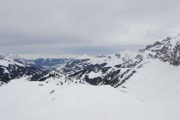 Obraz premium some time spent in switzerland alps while skiing, mostly cloudy weather, but beautiful landscape view of mountain peaks