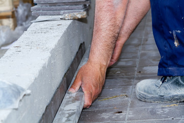 bricklayer at work in building site