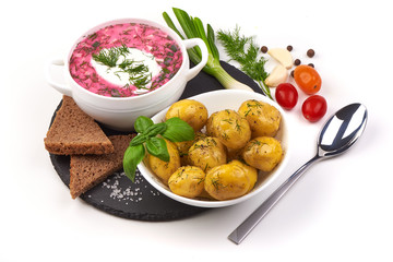 Beetroot soup with sour cream and fried potatoes, isolated on white background.