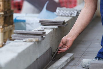 Fototapeta na wymiar bricklayer at work in building site
