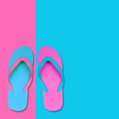 Pink and Blue Flip Flops on pastel colors background