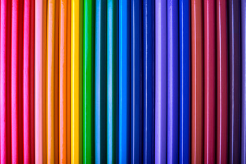 Obraz premium Color pencils background, close up. Set of colorful pencils, copy space. Crayons. Top view, flat lay. Back to school, college concept. Abstract background