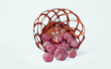 Fresh garden radish in wicker basket. Selective focus