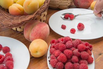 fresh berries on the table, food closeup. Delicious fruits on wooden background