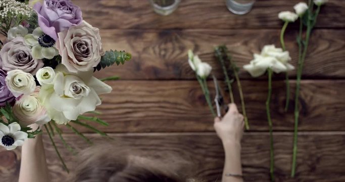 Taking Perfect Flowers for Your Wedding Bouquet. Young florist takes perfect flowers to make a wedding bouquet. Her flowers are wonderful, the colors are so rustic, she has perfect taste