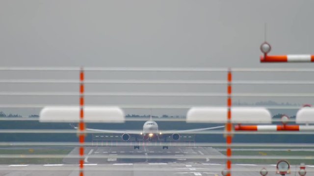 Airplane landing at rainy weather