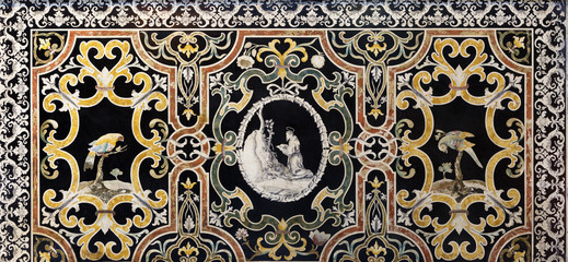 MODENA, ITALY - APRIL 14, 2018: The stone floral mosaic  (Pietra Dura) with the St. Francis of Assisi at the prayer in church Abbazia di San Pietro by Marco Mazelli (1640 -1713).