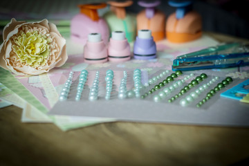 set for needlework on wooden table.