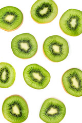 Fototapeta premium Kiwi fruit Slices macro. Ripe Kiwi fruit isolated on white background. Fresh tropical abstract background