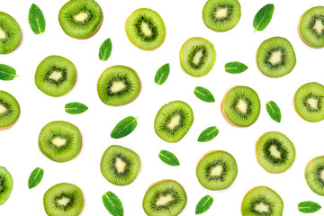 Fototapeta premium Fruit Pattern - Creative layout made of Kiwi fruits. Many slices of ripe Kiwifruit. Flat lay.