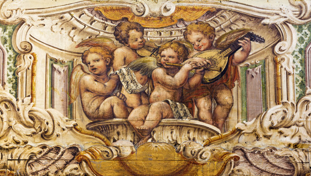 PARMA, ITALY - APRIL 15, 2018: The fresco of the choir of angels with the music instruments in church  Chiesa di Santa Cristina by Filippo Maria Galletti (1636 - 1714).