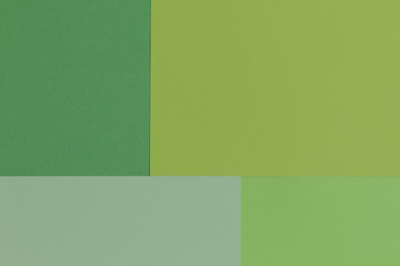 Creative geometric  paper background. Pattern of similar (monochrome) shades of green. Flat lay.