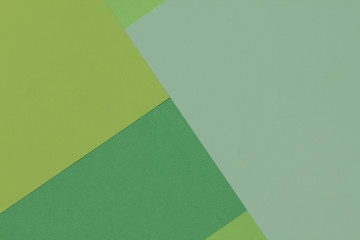 Creative geometric  paper background. Pattern of similar (monochrome) shades of green. Flat lay.
