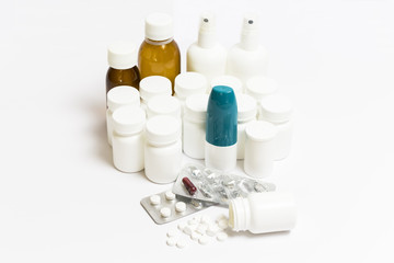 Fototapeta na wymiar group of pills, medicine bottles, spray and syrups on a white background 