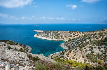 Fototapeta na wymiar Beautiful calm bay with pine trees and blue clear sea at warm sunny summer day. Mediterranean sea, Turkey.