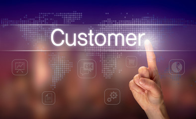 Fototapeta premium A hand selecting a Customer business concept on a clear screen with a colorful blurred background.
