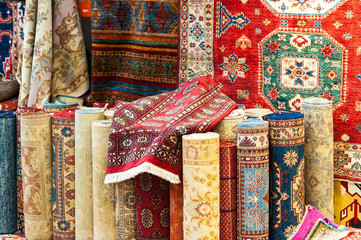 Carpets variety selection rolled up rugs shop store.