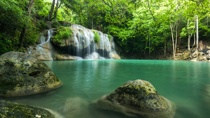 Fototapeta premium Beautiful and Breathtaking green waterfall at the tropical rain forest, Erawan's waterfall, Located Kanchanaburi Province, Thailand
