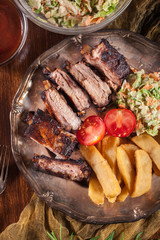 Spicy barbecued pork ribs with french fries