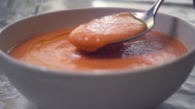 Fresh and tasty A bowl of Salmorejo. Typical summer meal, puree consisting of tomato and bread, originating from Cordoba in Andalucia, south Spain. It is made from tomatoes, bread, oil, garlic.