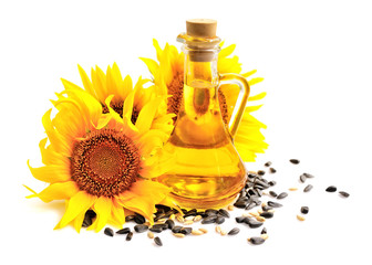 Sunflower oil with flowers and by seed on white background