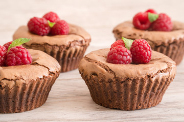 Delicious chocolate lava cakes with fresh raspberries and mint, detail