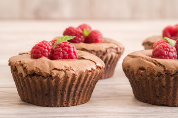 Delicious chocolate lava cakes with fresh raspberries and mint, detail