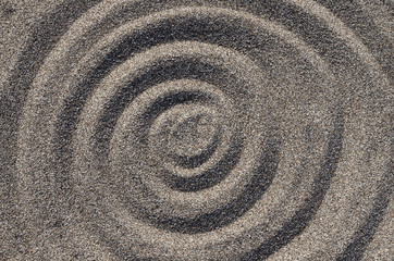 Fototapeta na wymiar Abstract pattern in the form of circles on the tiny marine stones