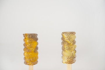 Popsicle of orange and lemon with chia