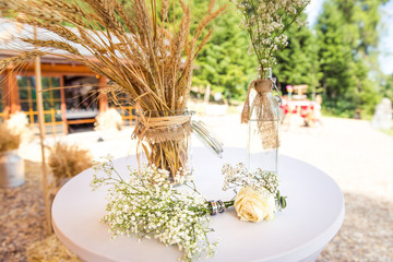 Wedding Rings Around Gypsophila on Wedding Table.