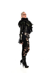 full length portrait of blonde girl wearing torn black feather costume. standing pose, isolated on white background.
