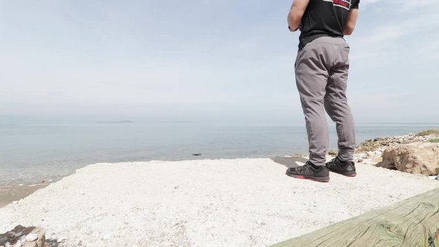 Man setting up and flying drone