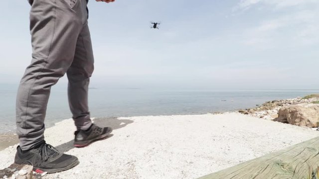Man setting up and flying drone