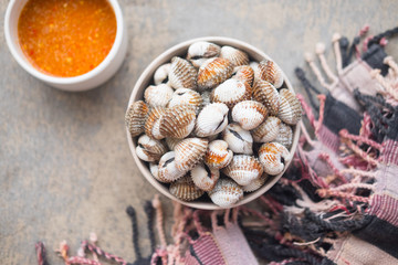 Boiled cockles with tasty sauce