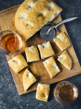 Genoese focaccia bread snacks with rose wine